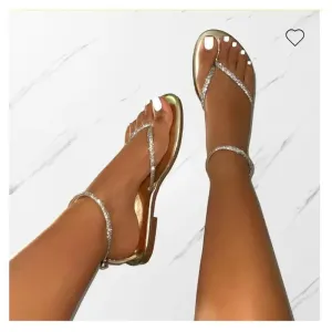 Flat sandals with gold details